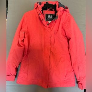 Women’s waterproof jacket with lots of pockets and zipper vents great condition